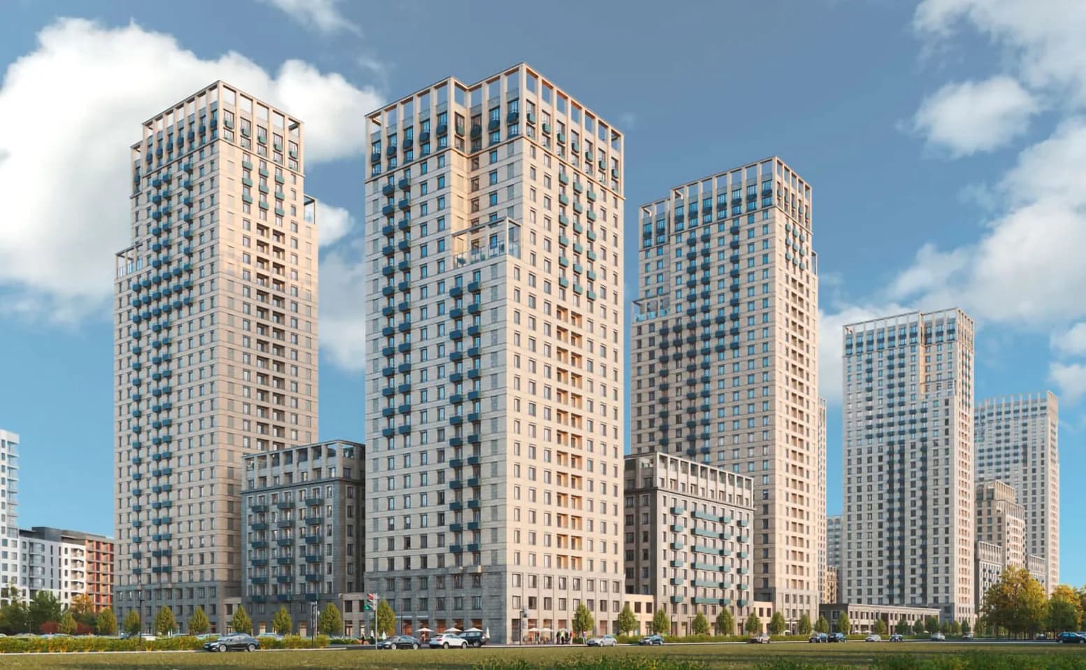 Светлые башни квартала «Метроном» на фоне летнего неба